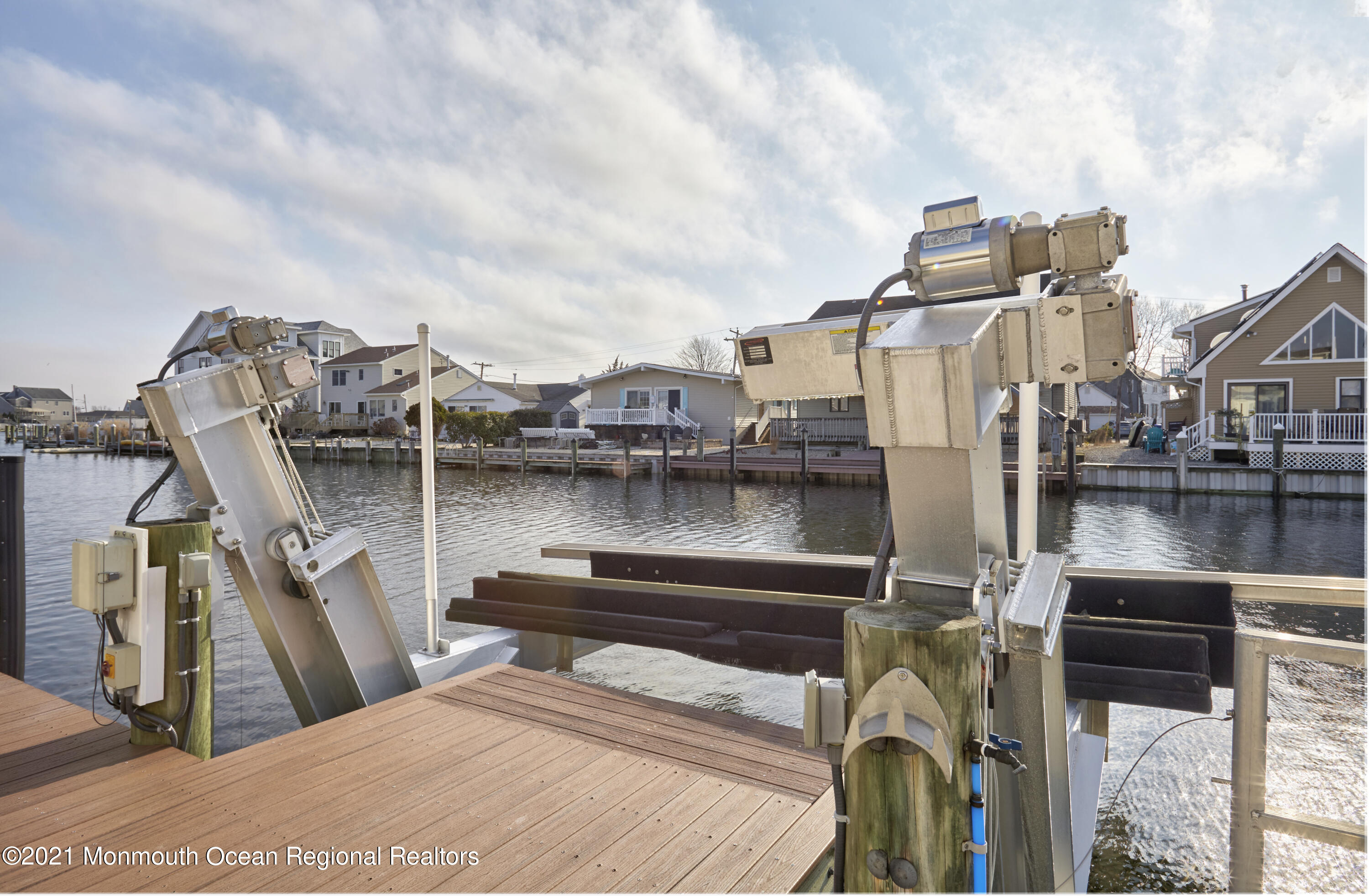 6 Topsail Road Brick, NJ 08723 - Photo 43 of 43 a view of a lake with a car parked on the deck