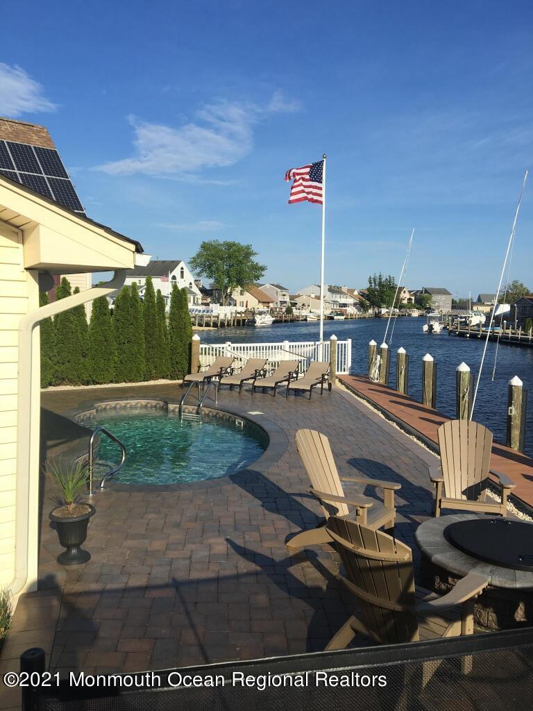 6 Topsail Road Brick, NJ 08723 - Photo 7 of 43 a picture of a table and chairs in patio