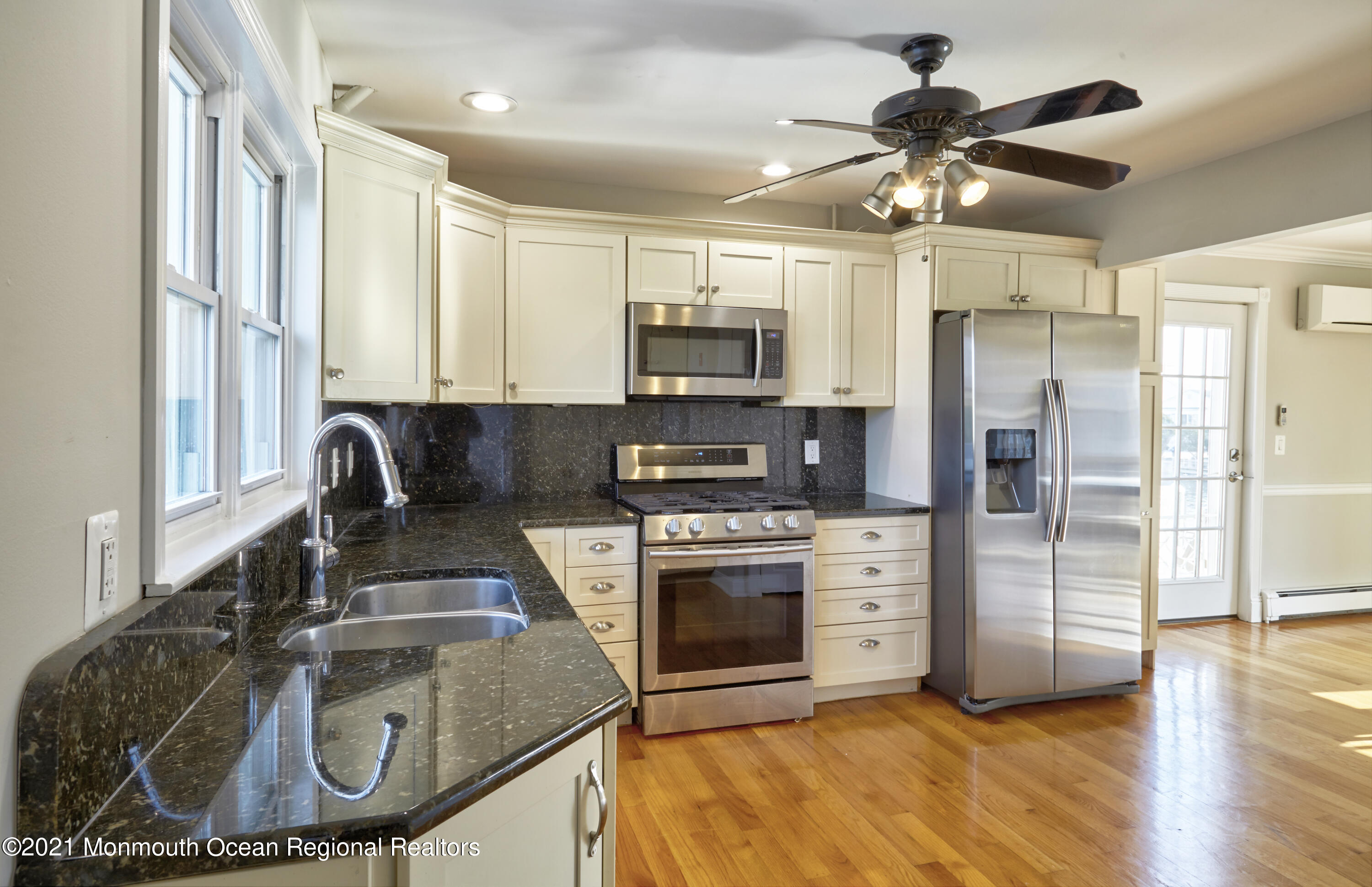 6 Topsail Road Brick, NJ 08723 - Photo 9 of 43 a kitchen with granite countertop a stove a sink and a refrigerator