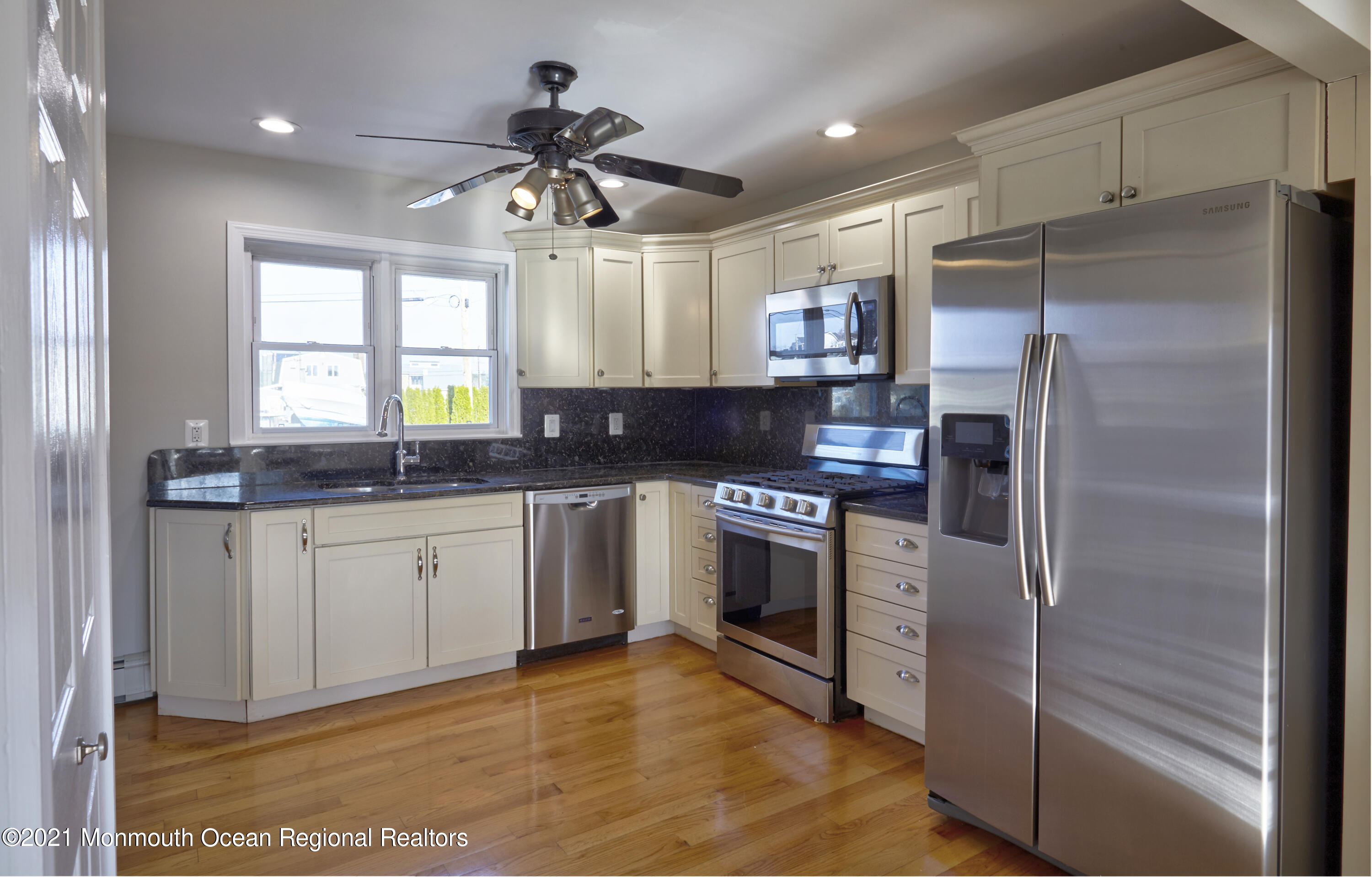 6 Topsail Road Brick, NJ 08723 - Photo 10 of 43 a kitchen with granite countertop a refrigerator and a sink