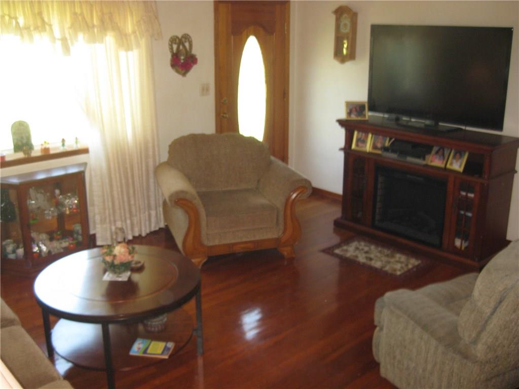 2733 Old Rte 18 Wampum, PA 16157 - Photo 6 of 17 Beautiful original hardwood floors, electric fireplace stays!