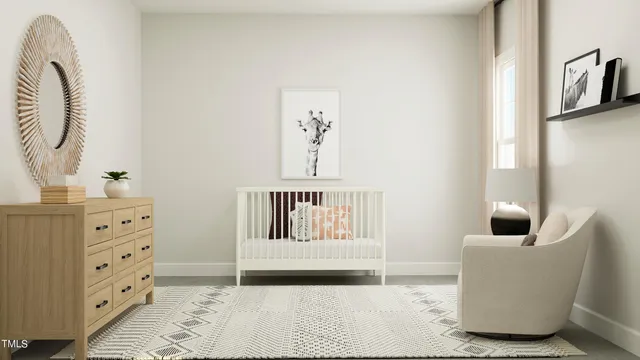 a bedroom with a baby bed and a couch