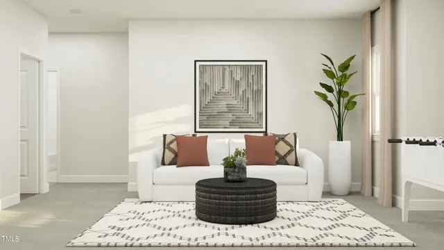 a living room with furniture and a rug