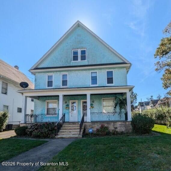 1329-1331 Oram Street Scranton, PA 18504 - Photo 1 of 29 front view of brick house with a yard
