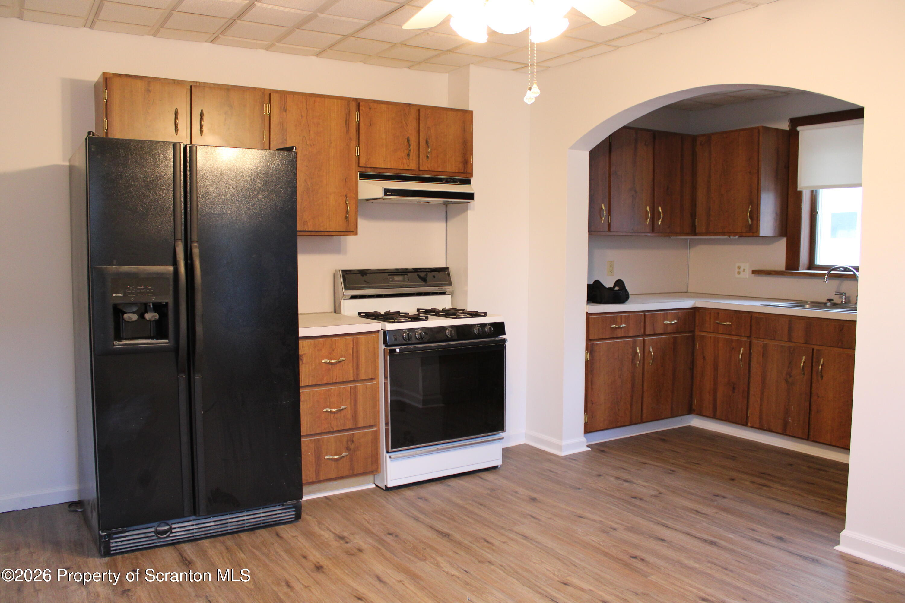 1329-1331 Oram Street Scranton, PA 18504 - Photo 16 of 29 a kitchen with stainless steel appliances a refrigerator and a sink