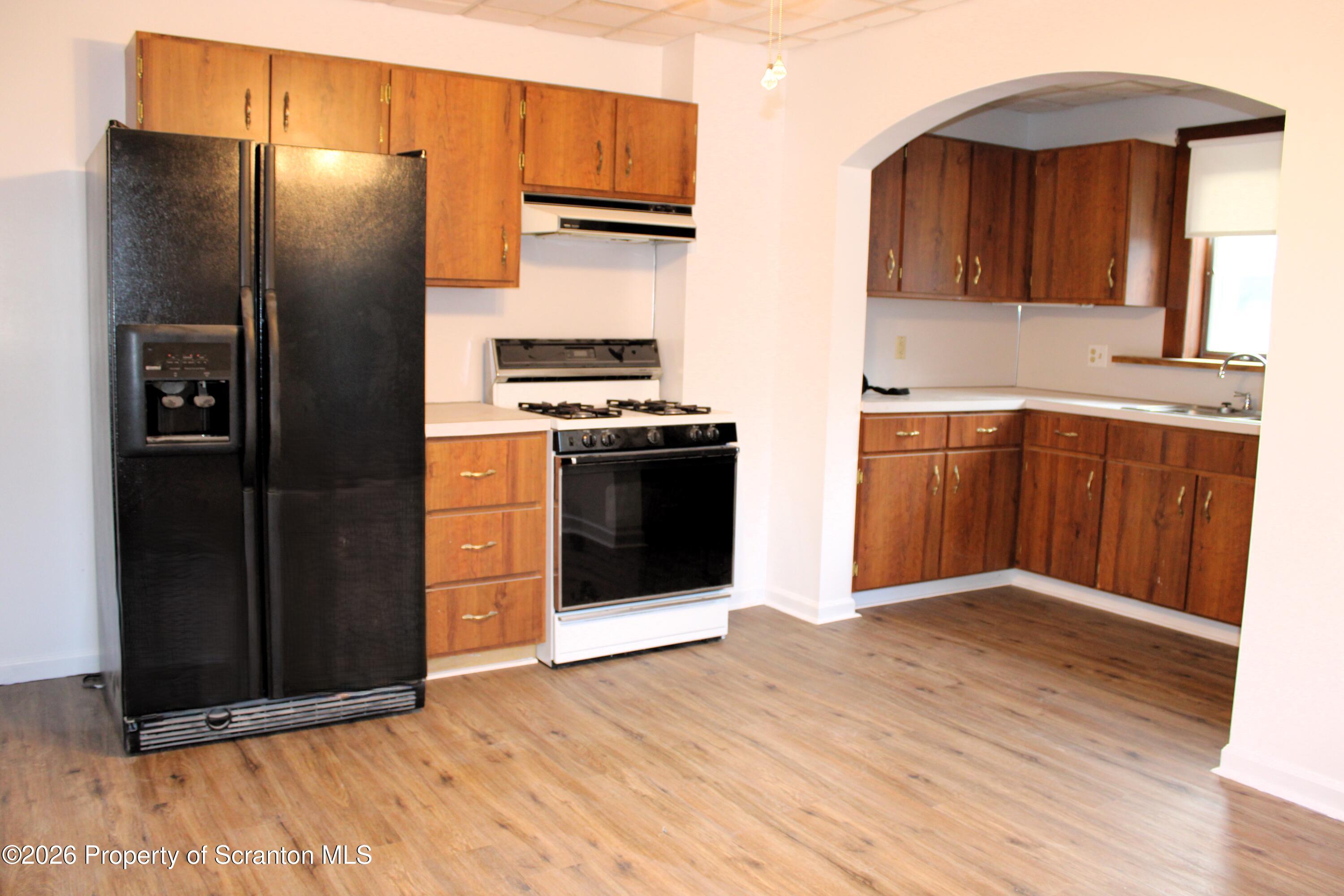 1329-1331 Oram Street Scranton, PA 18504 - Photo 17 of 29 a kitchen with stainless steel appliances granite countertop a refrigerator and a sink