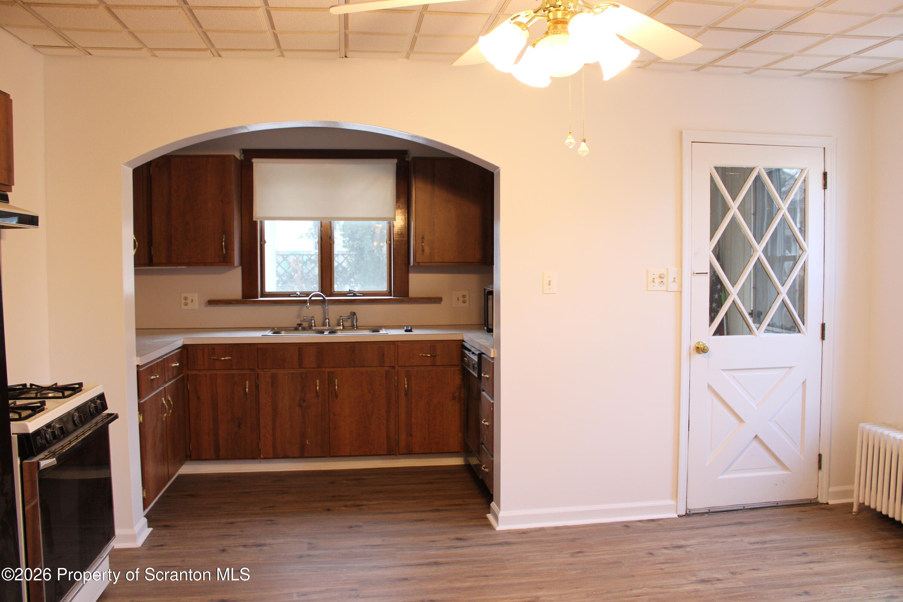 1329-1331 Oram Street Scranton, PA 18504 - Photo 19 of 29 a view of a hallway with wooden floor and a cabinet