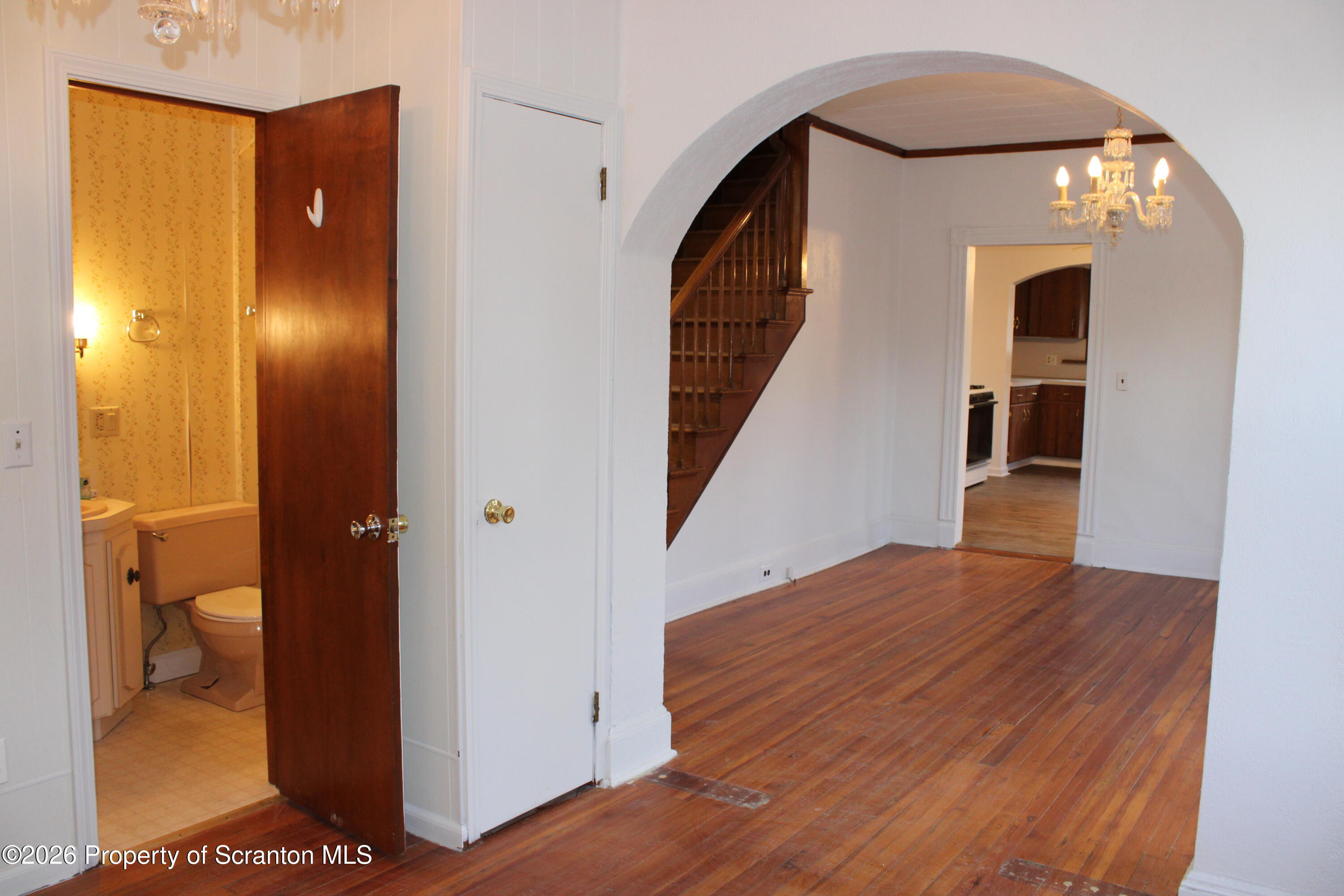 1329-1331 Oram Street Scranton, PA 18504 - Photo 20 of 29 a view of a hallway with wooden floor and staircase