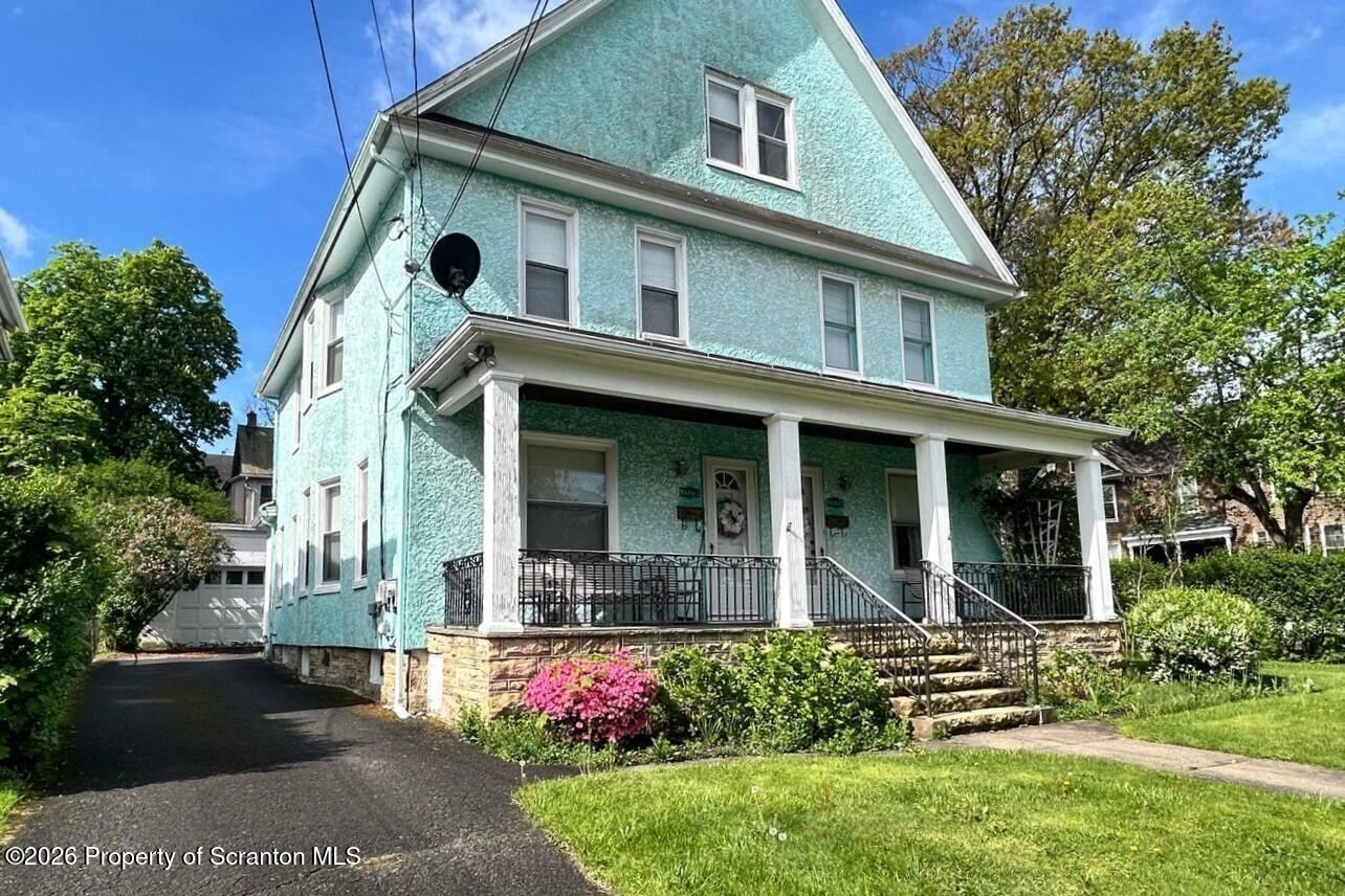 1329-1331 Oram Street Scranton, PA 18504 - Photo 2 of 29 a front view of a house with a yard