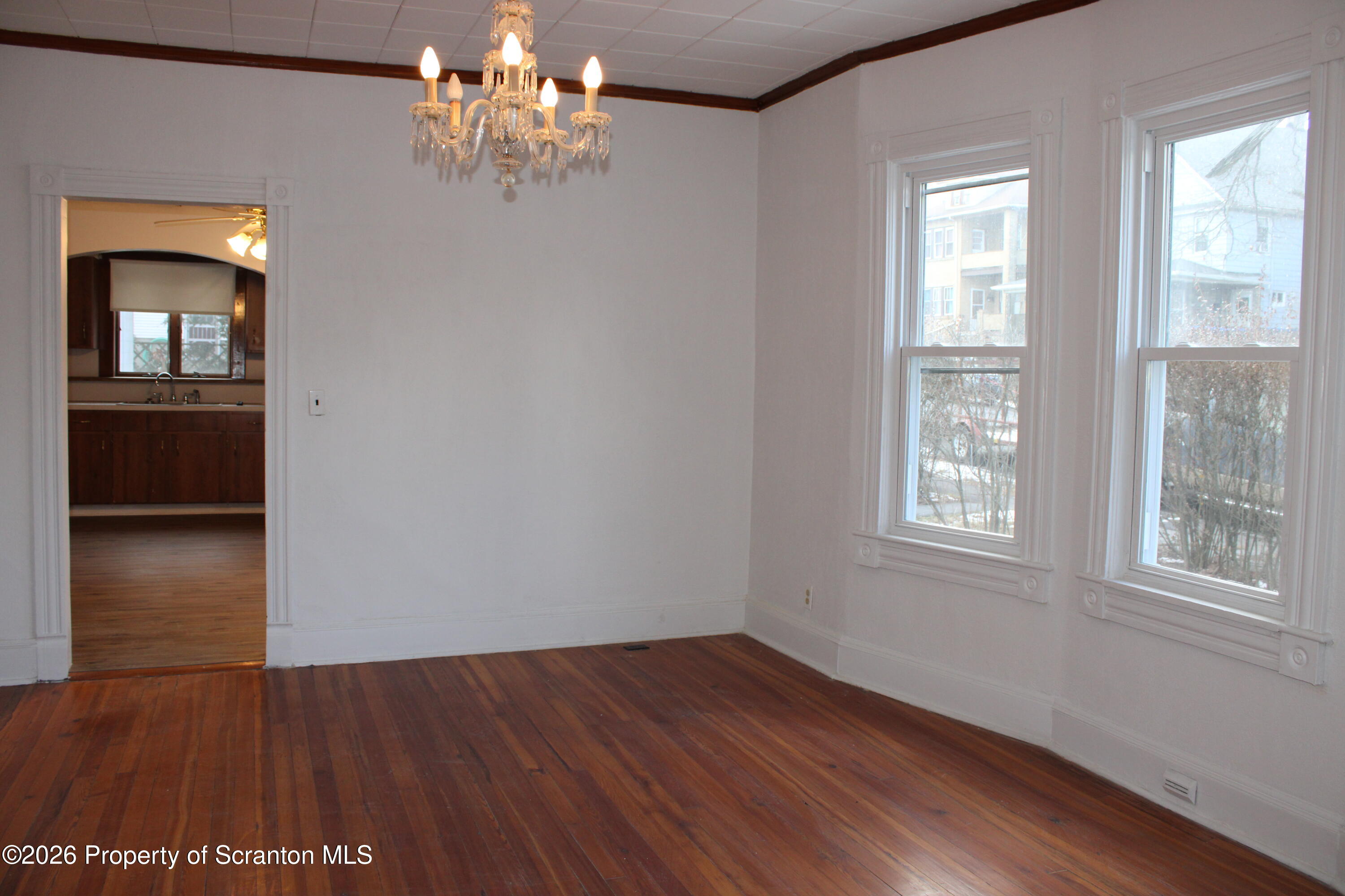 1329-1331 Oram Street Scranton, PA 18504 - Photo 21 of 29 a view of livingroom with chandelier and wooden floor