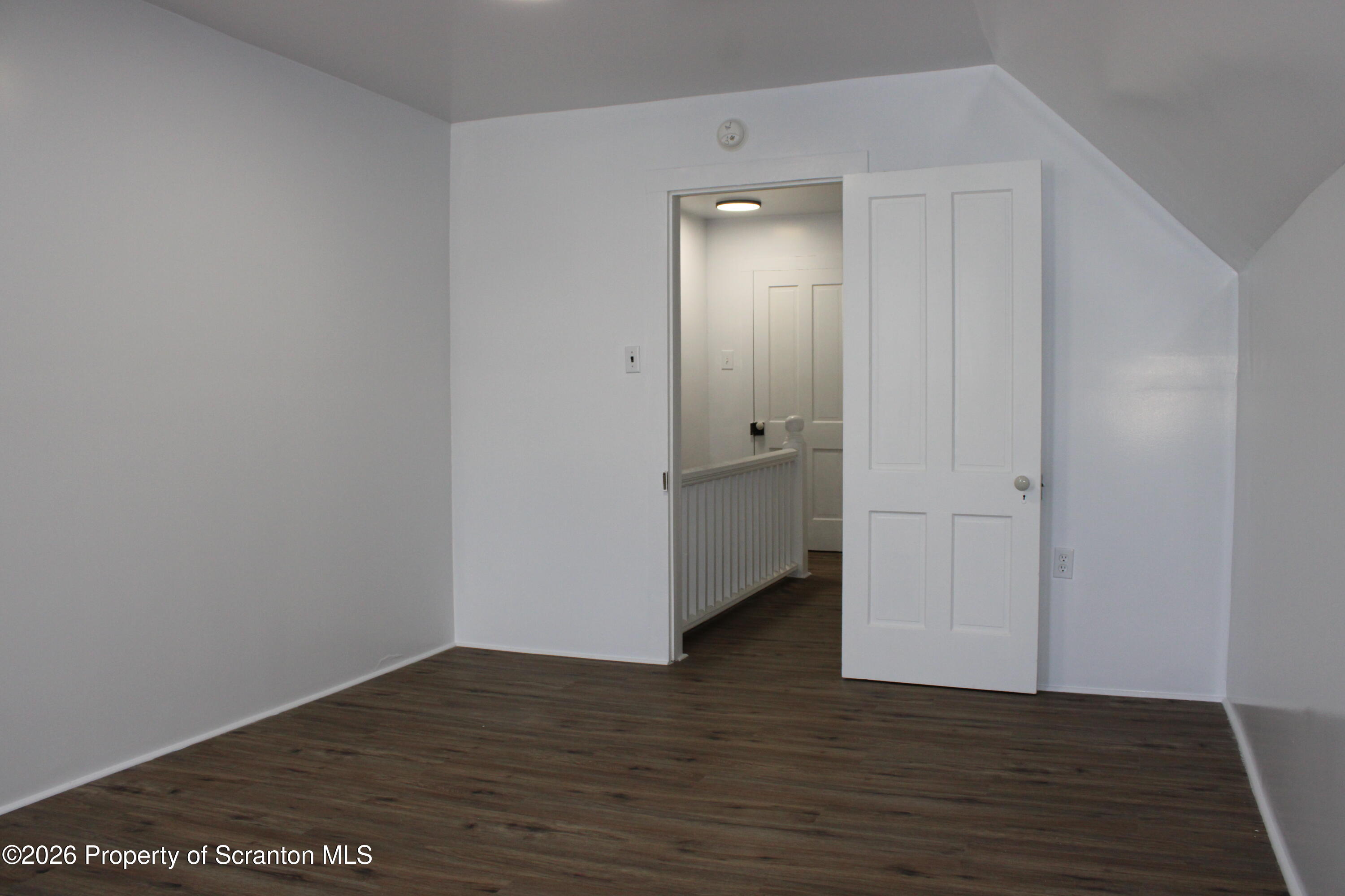 1329-1331 Oram Street Scranton, PA 18504 - Photo 26 of 29 a view of an empty room with wooden floor