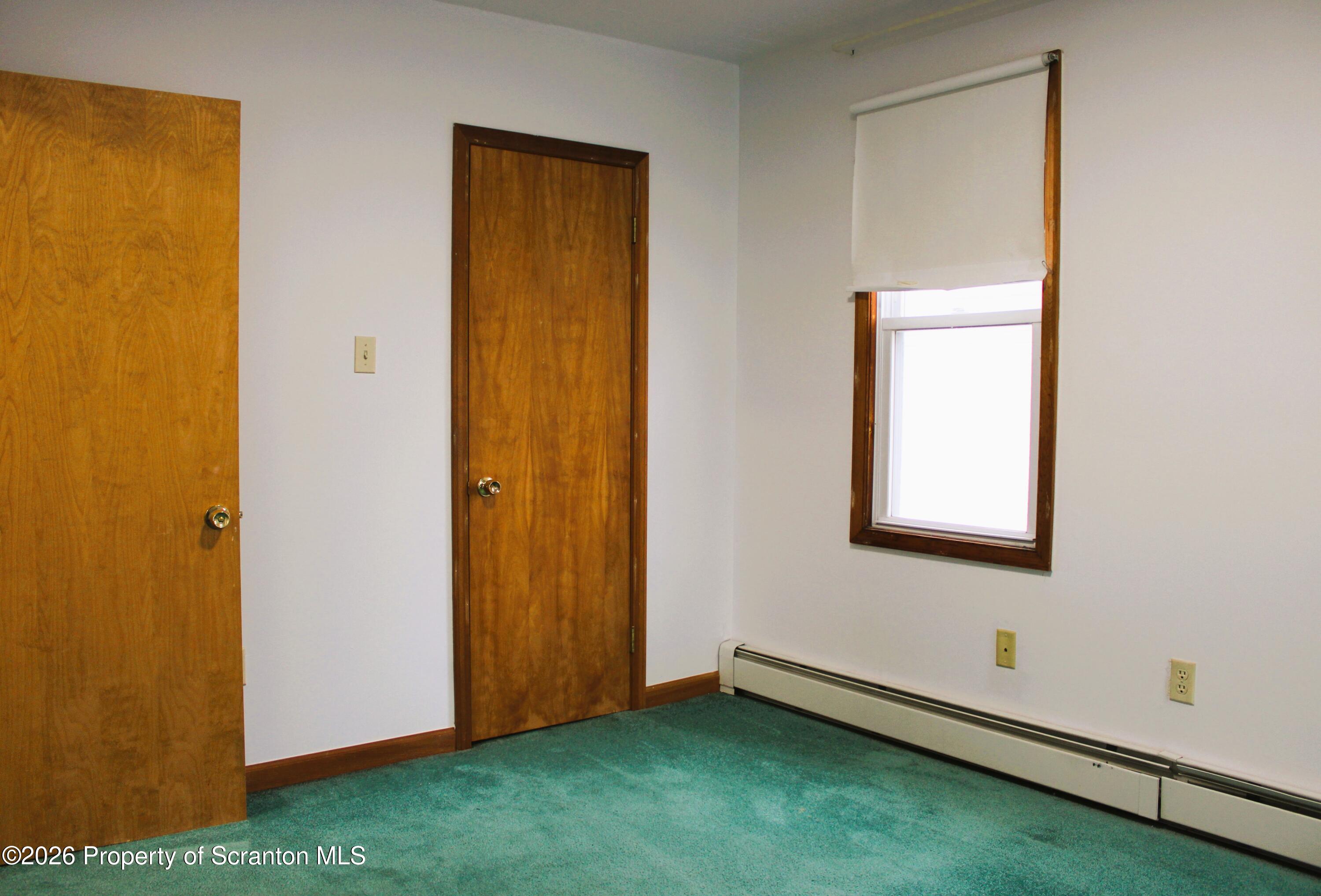 1329-1331 Oram Street Scranton, PA 18504 - Photo 3 of 29 a view of an empty room and window