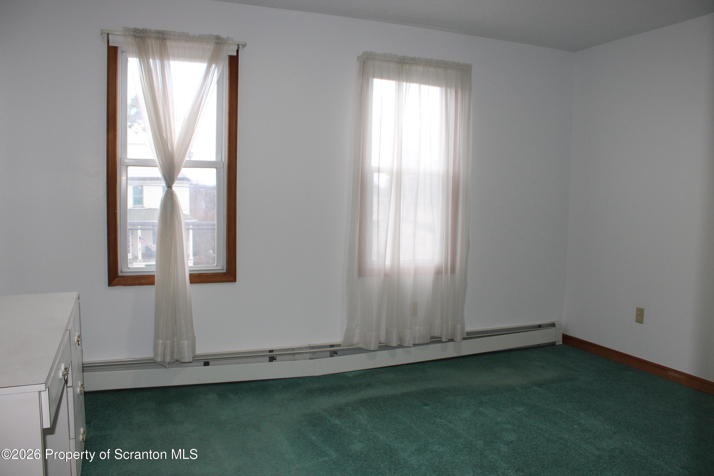 1329-1331 Oram Street Scranton, PA 18504 - Photo 4 of 29 a view of an empty room with a window