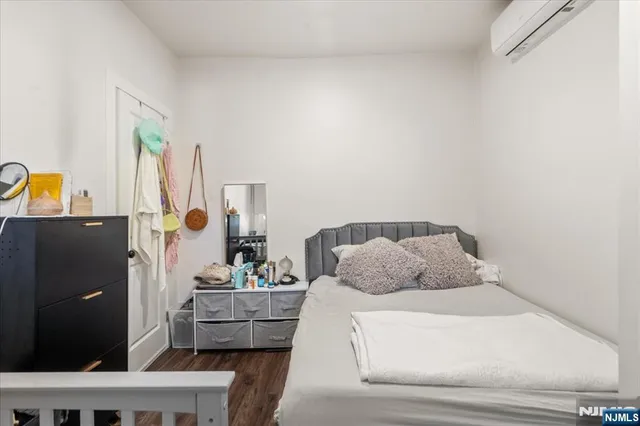 a bedroom with a bed and furniture