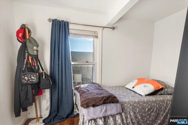 a bedroom with a bed and a closet