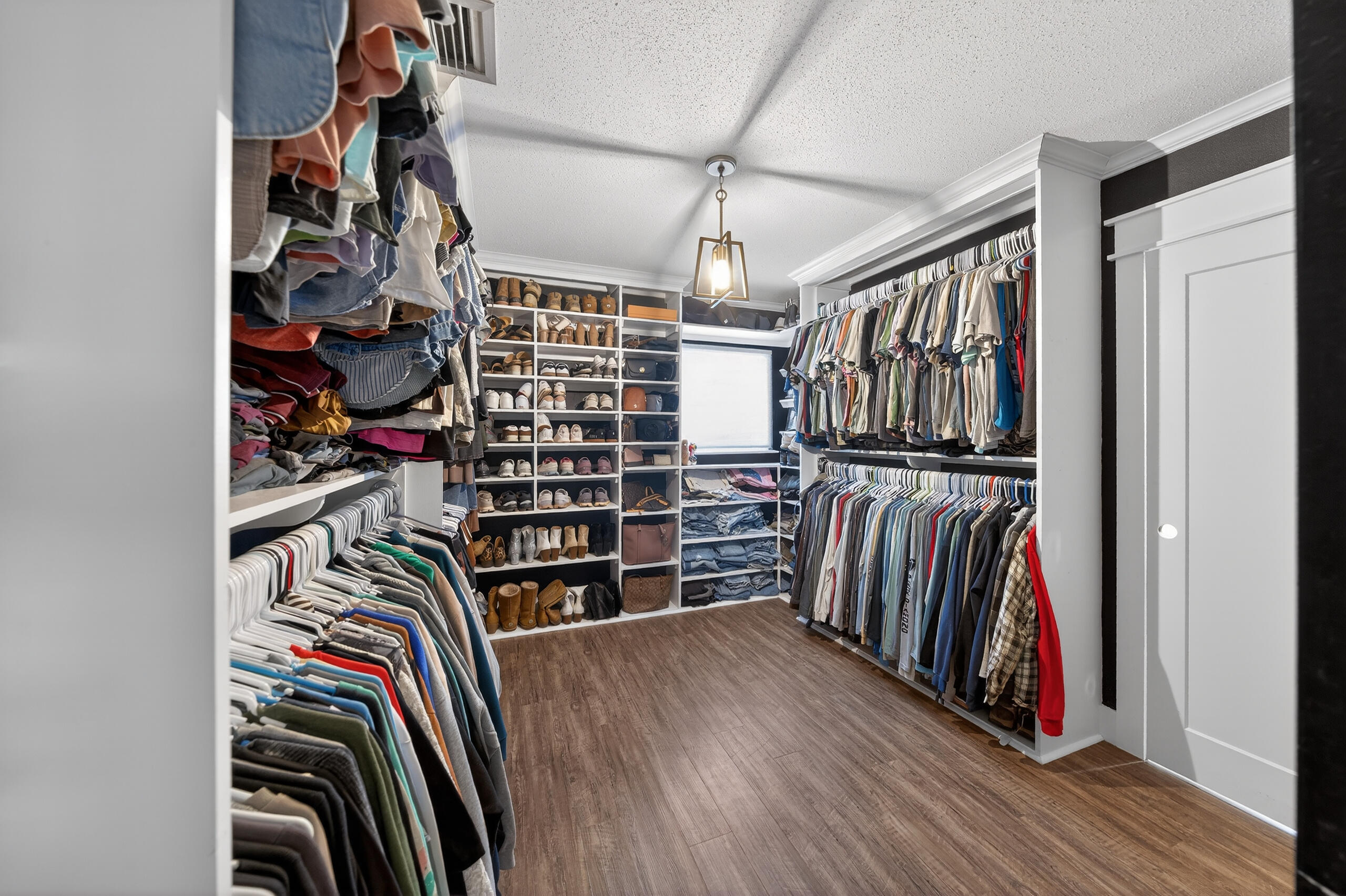 837 Cardinal Street Fort Walton Beach, FL 32547 - Photo 21 of 44 a view of walk in closet with clothes and shoes