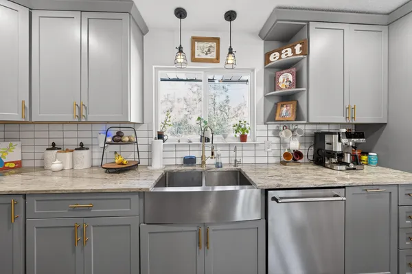 a view of a dining room with furniture wooden floor and chandelier