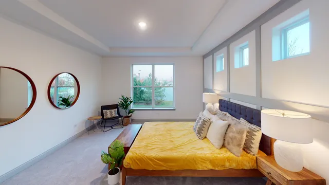 a bed room with a bed and a window