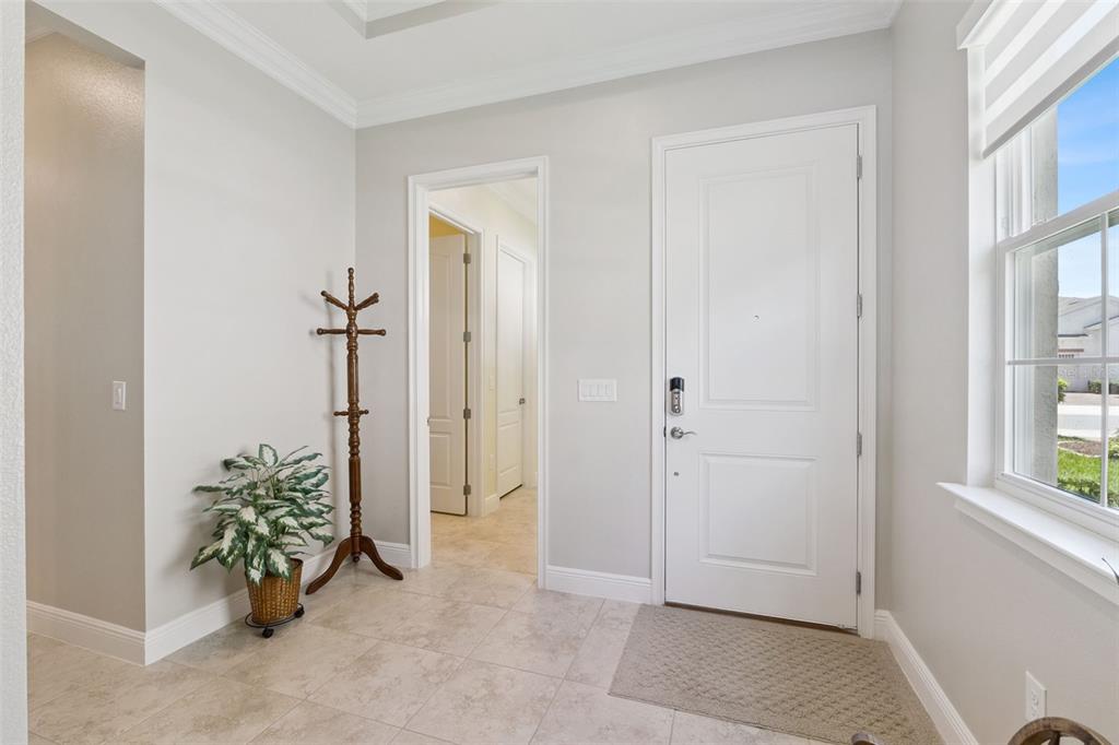 2665 Meadowedge Loop St. Cloud, FL 34772 - Photo 36 of 53 a view of entryway with window and hardwood floor