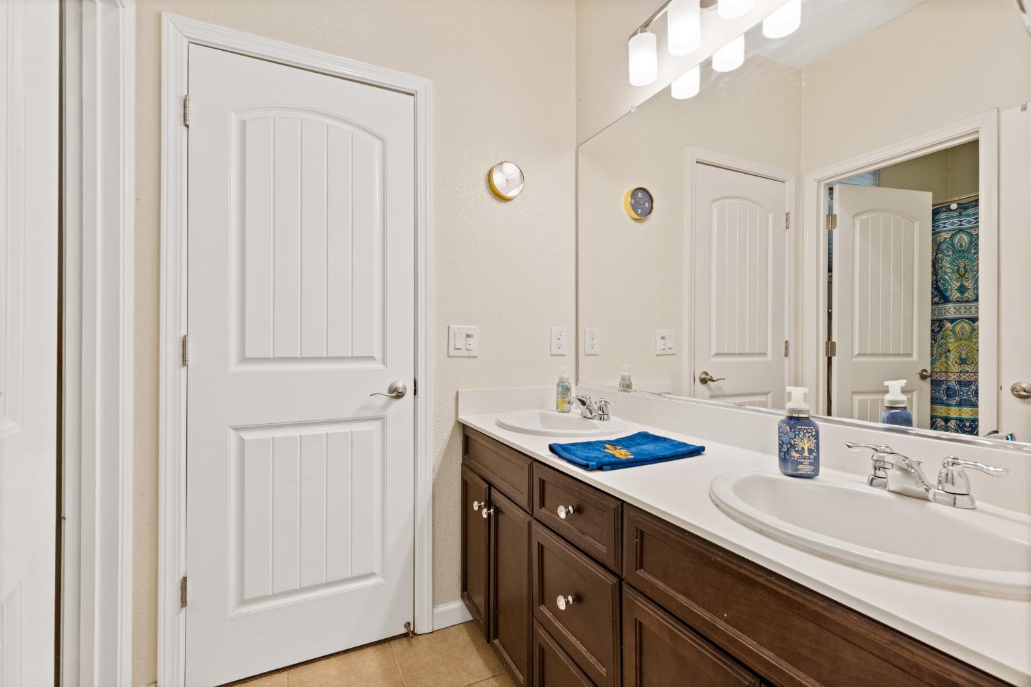 2011 Roy Ranch Way Plumas Lake, CA 95961 - Photo 22 of 49 a bathroom with a double vanity sink and a mirror