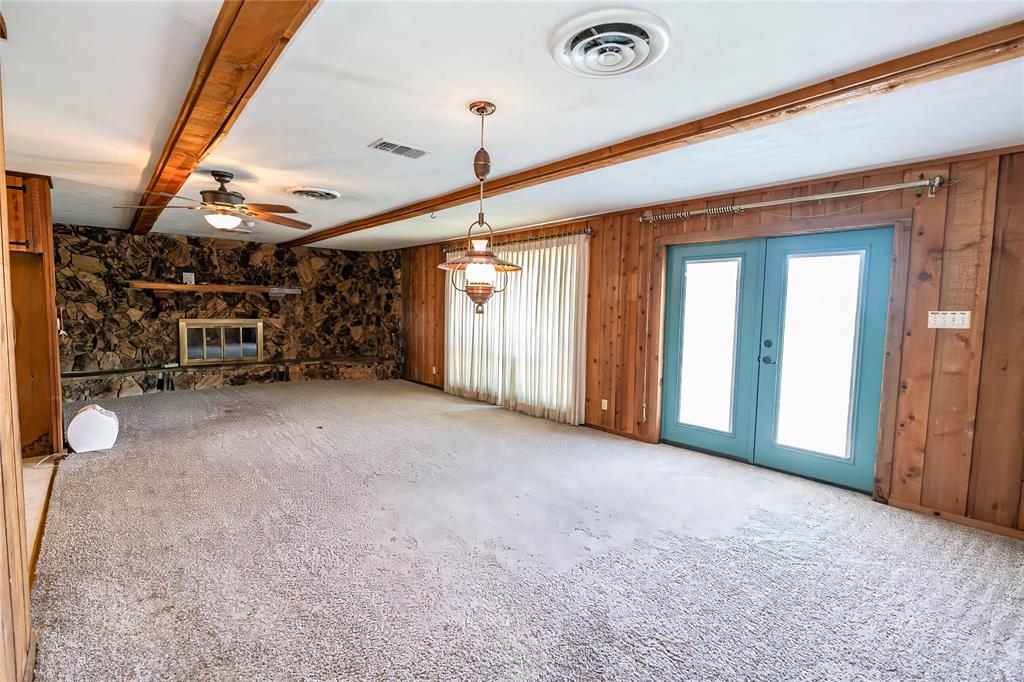 722 Storey Road Nocona, TX 76255 - Photo 11 of 40 a view of empty room with wooden floor