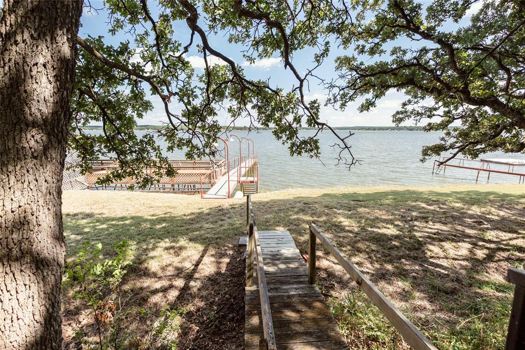 722 Storey Road Nocona, TX 76255 - Photo 4 of 40 a view of yard with tree
