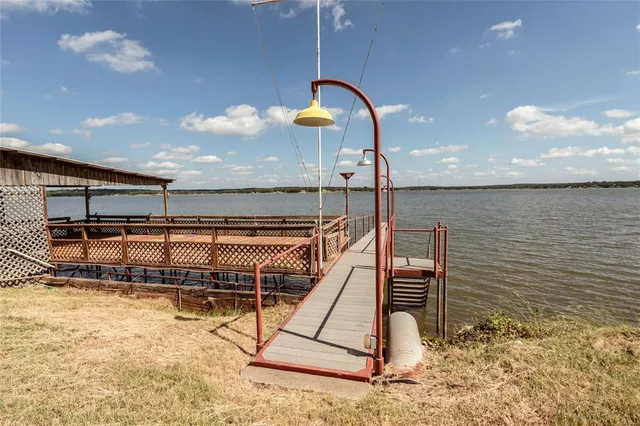 a swimming pool with a lake view