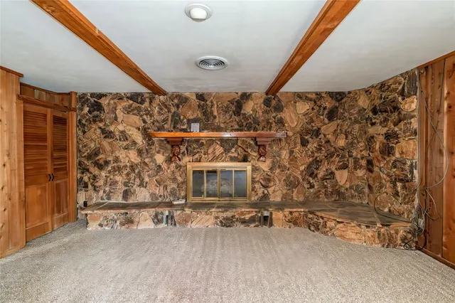 a view of a room with wooden walls