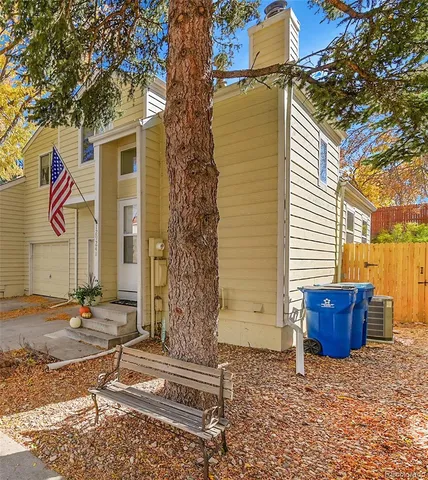 a front view of a house with tree s