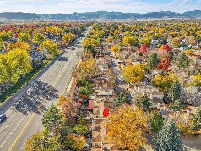 an aerial view of residential building and ocean