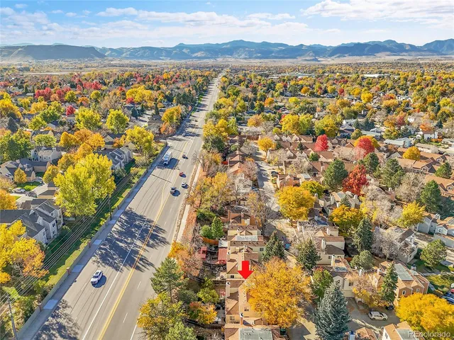 an aerial view of residential building with parking space