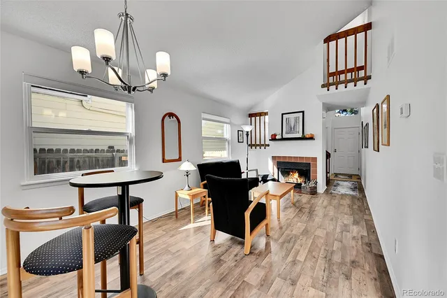 a view of a livingroom with furniture and a fireplace