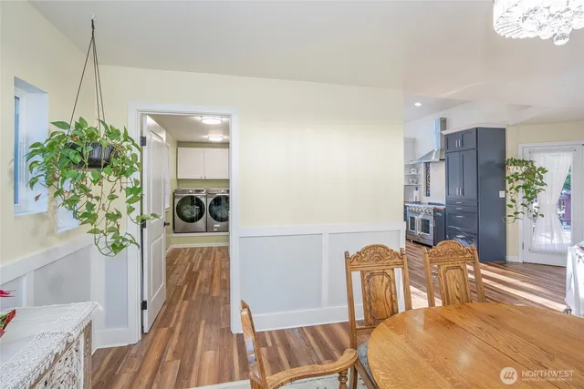 a view of a dining room with furniture and a potted plant