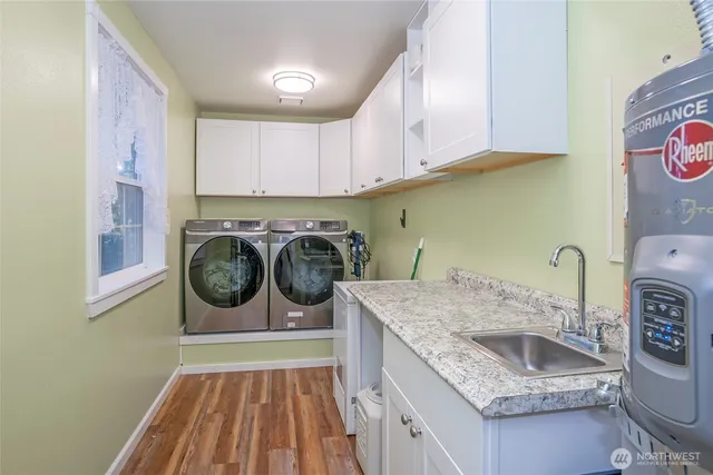 a view of a kitchen with washer and dryer
