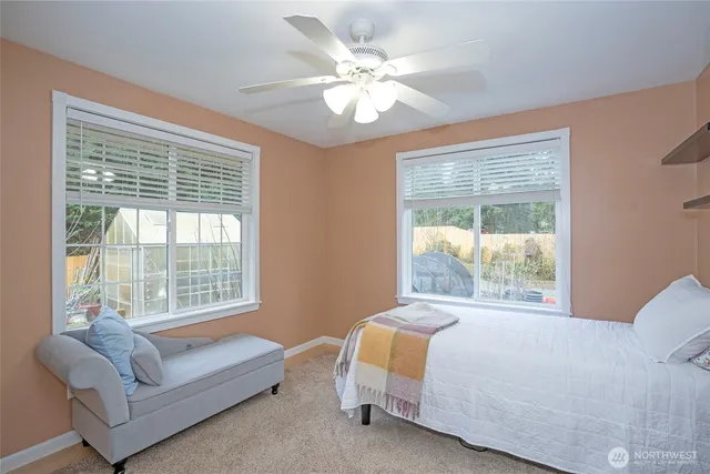 a bedroom with a bed and a couch