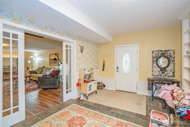 a bedroom with furniture and a window