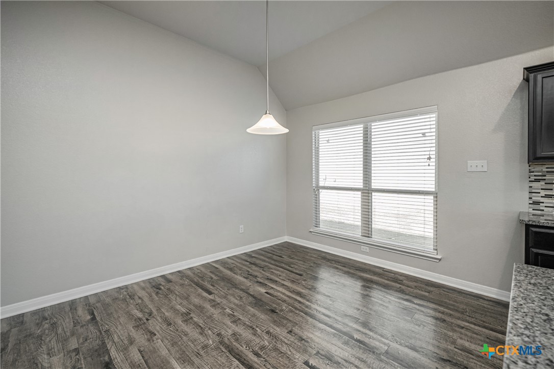 8109 Northgate Loop Temple, TX 76502 - Photo 12 of 35 an empty room with wooden floor and windows