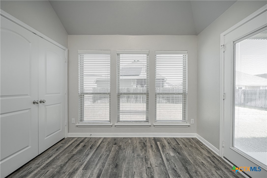 8109 Northgate Loop Temple, TX 76502 - Photo 15 of 35 a view of an empty room with wooden floor and a window