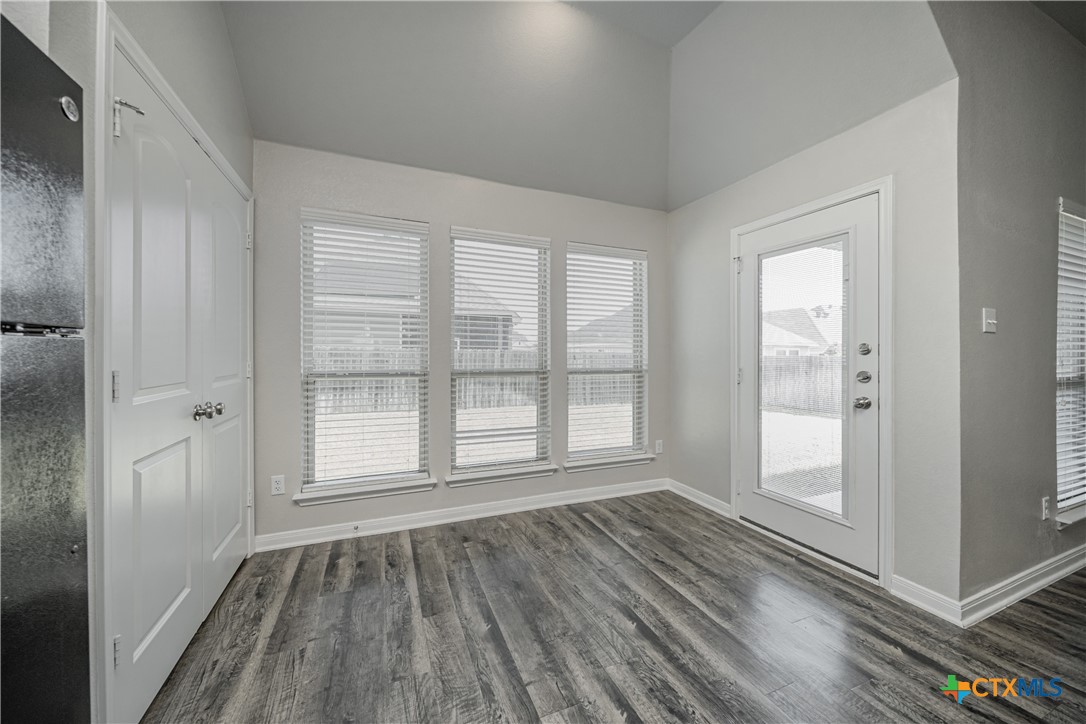 8109 Northgate Loop Temple, TX 76502 - Photo 16 of 35 a view of an empty room with glass door and wooden floor