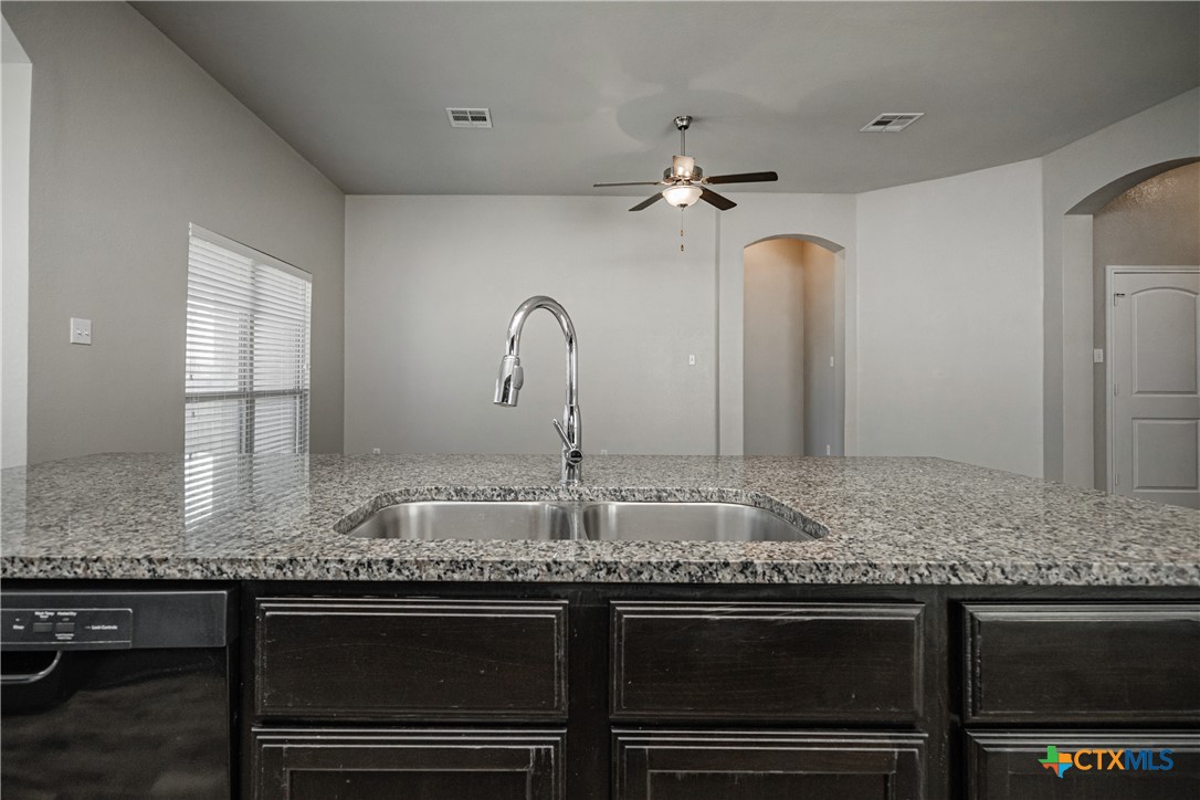 8109 Northgate Loop Temple, TX 76502 - Photo 18 of 35 a bathroom with a granite countertop sink vanity granite and stainless steel appliances