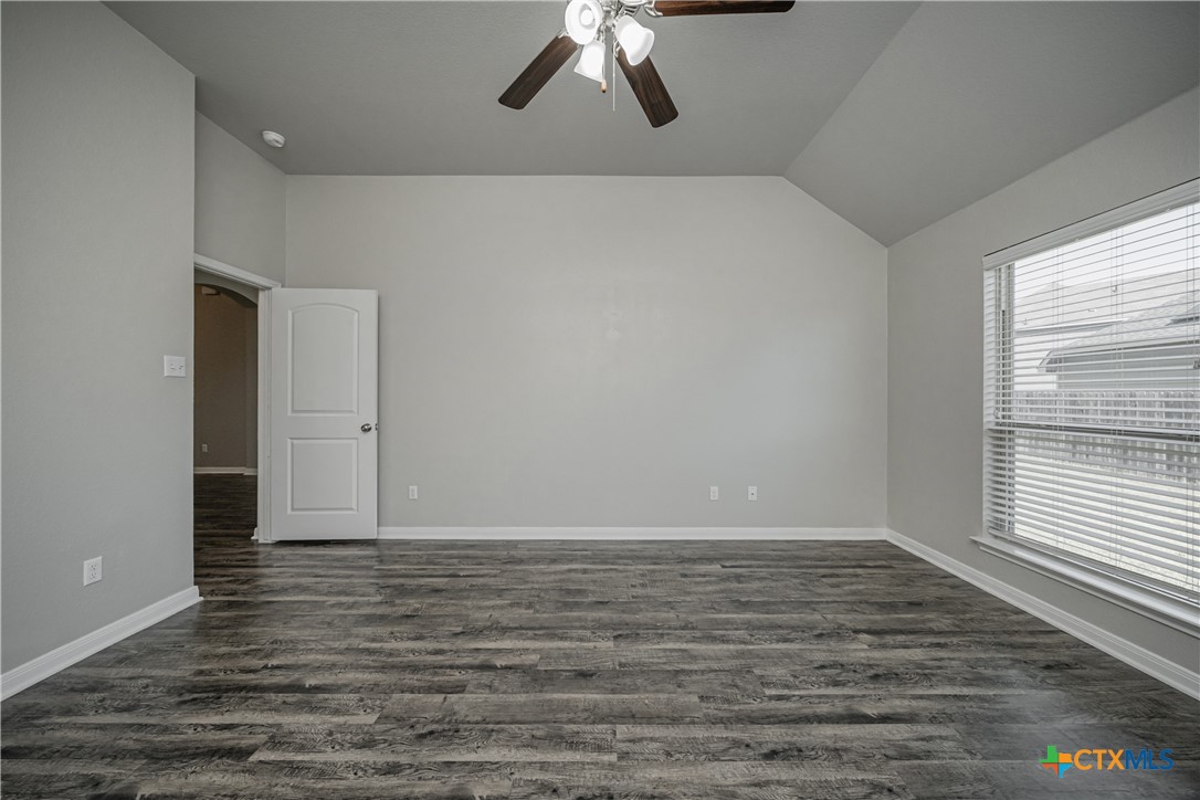 8109 Northgate Loop Temple, TX 76502 - Photo 23 of 35 a view of an empty room with wooden floor and window