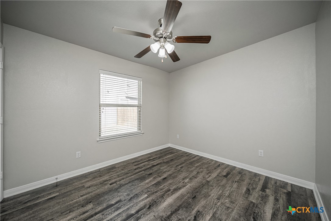 8109 Northgate Loop Temple, TX 76502 - Photo 30 of 35 wooden floor in an empty room with a window