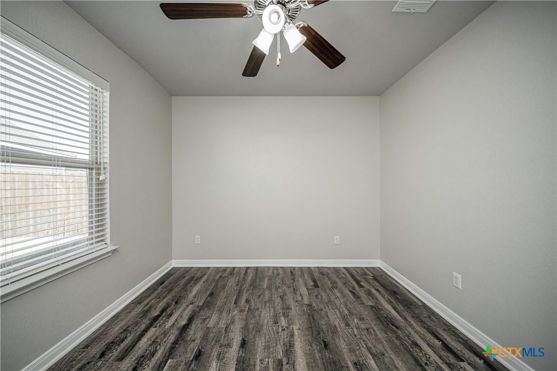 8109 Northgate Loop Temple, TX 76502 - Photo 31 of 35 a view of empty room with wooden floor and fan