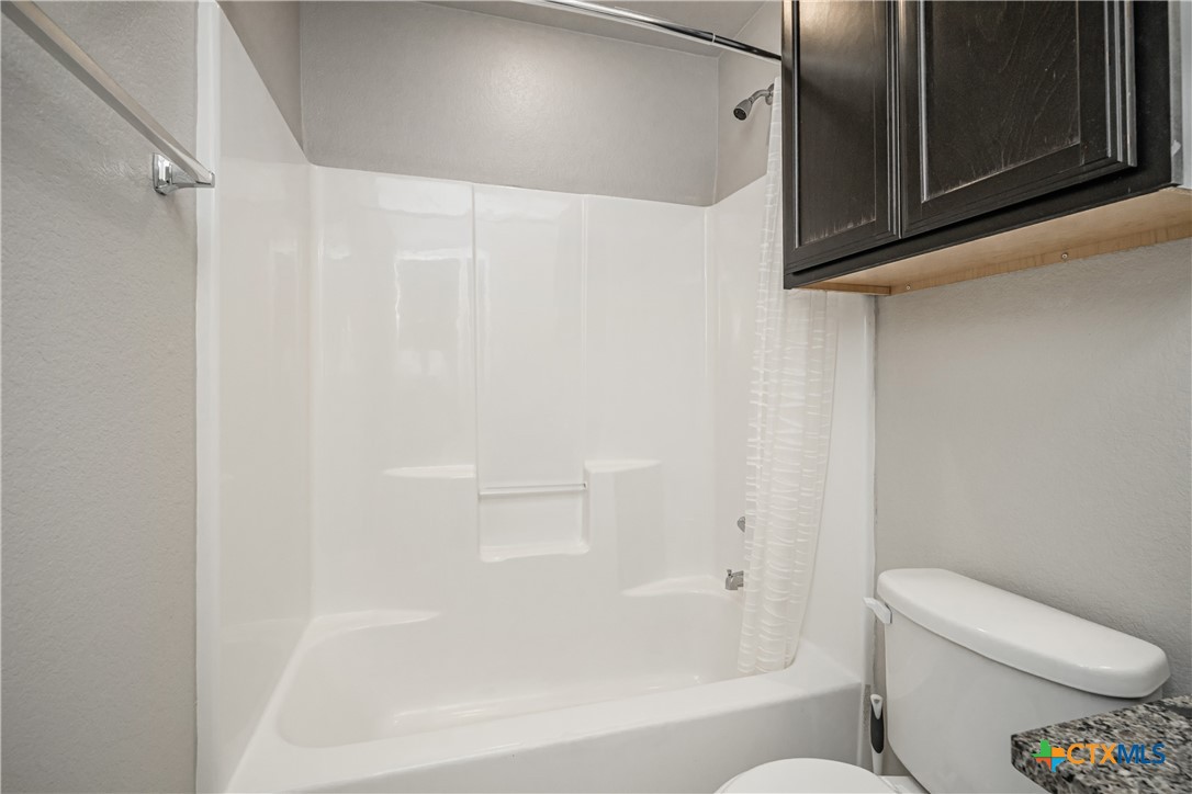 8109 Northgate Loop Temple, TX 76502 - Photo 33 of 35 a bathroom with a toilet and a shower