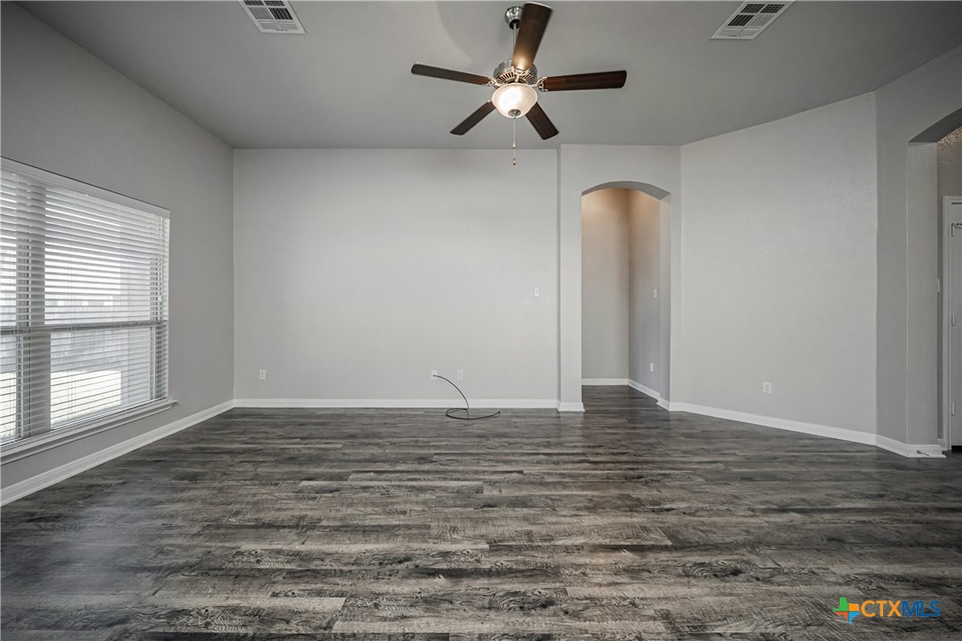 8109 Northgate Loop Temple, TX 76502 - Photo 9 of 35 a view of room with hardwood floor and ceiling fan