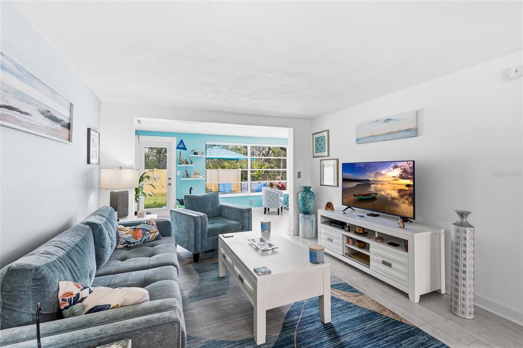 4467 Rustic Drive New Port Richey, FL 34652 - Photo 11 of 44 a living room with furniture and a flat screen tv