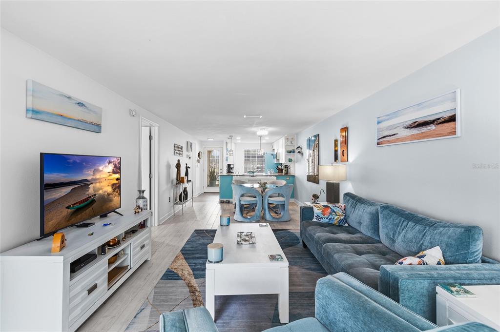 4467 Rustic Drive New Port Richey, FL 34652 - Photo 13 of 44 a living room with furniture and a flat screen tv