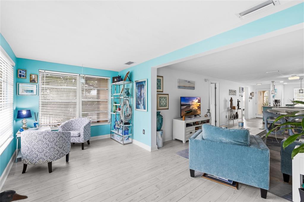 4467 Rustic Drive New Port Richey, FL 34652 - Photo 14 of 44 a living room with furniture and a flat screen tv