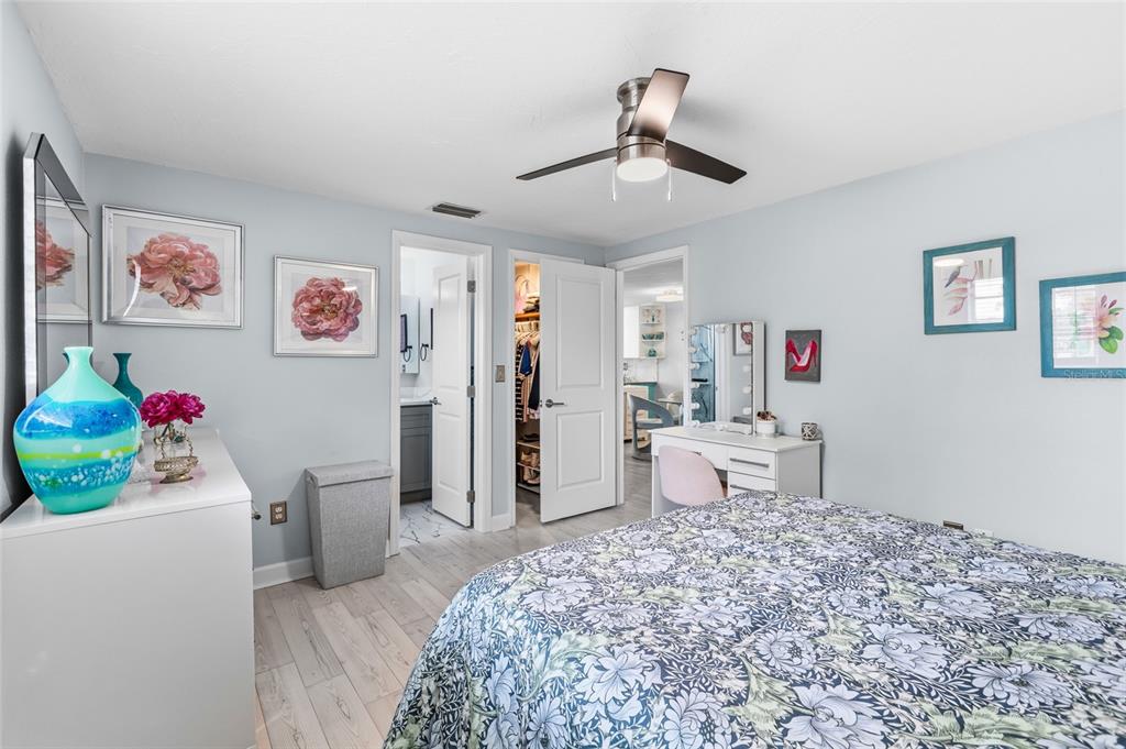 4467 Rustic Drive New Port Richey, FL 34652 - Photo 17 of 44 a bedroom with a bed and cabinets