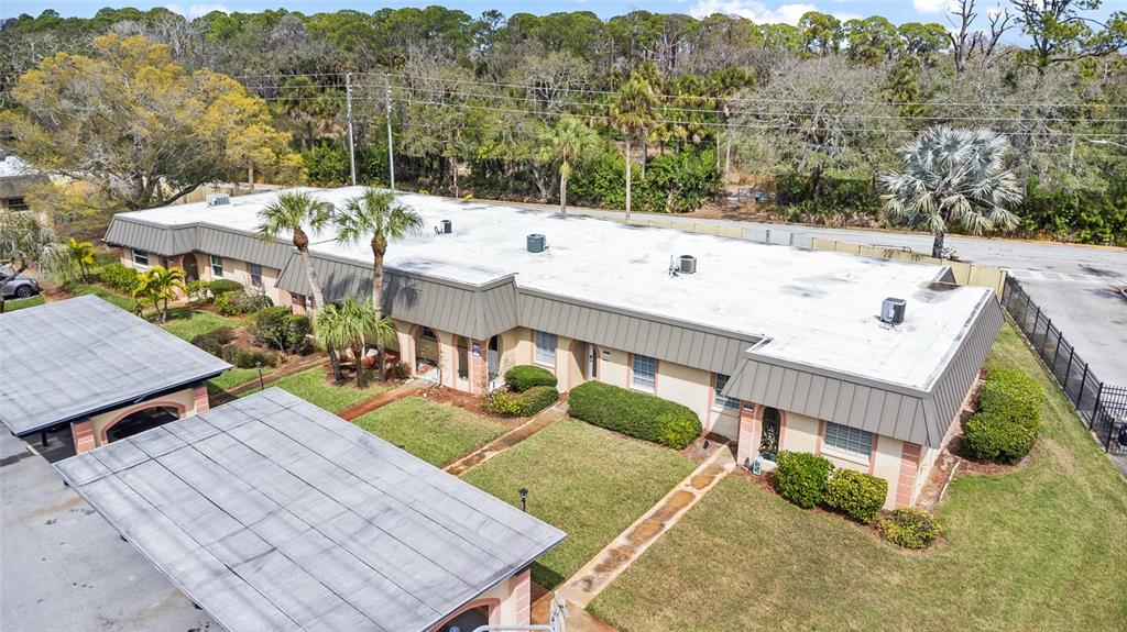 4467 Rustic Drive New Port Richey, FL 34652 - Photo 36 of 44 an aerial view of a house with a yard